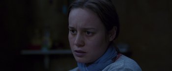 Movie still from “Room” (2015), directed by Lenny Abrahamson – A person wearing a neck scarf; Close Up shot, Over the shoulder angle
