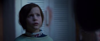 Movie still from “Room” (2015), directed by Lenny Abrahamson – A young girl is looking into the distance; Close Up shot, Low angle