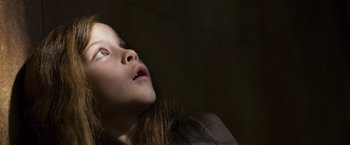 Movie still from “Room” (2015), directed by Lenny Abrahamson – A little girl looking up at the sky with her mouth open; Close Up shot, Low angle