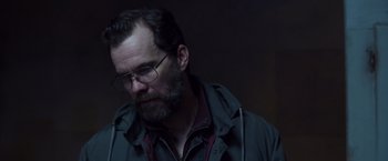 Movie still from “Room” (2015), directed by Lenny Abrahamson – A man with a beard wearing glasses and a jacket; Close Up shot, Low angle