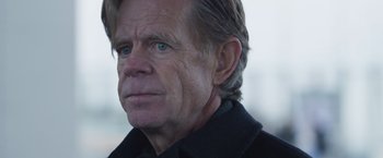 Movie still from “Room” (2015), directed by Lenny Abrahamson – An older man wearing a black shirt and looking at the camera; Close Up shot, Over the shoulder angle