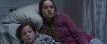 Movie still from “Room” (2015), directed by Lenny Abrahamson – A woman sitting in a bed with a child; Close Up shot, Over the shoulder angle
