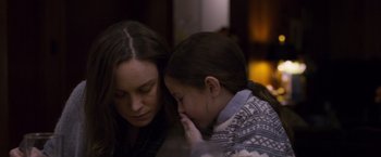 Movie still from “Room” (2015), directed by Lenny Abrahamson – A woman and a girl sitting next to each other; Close Up shot, Over the shoulder angle