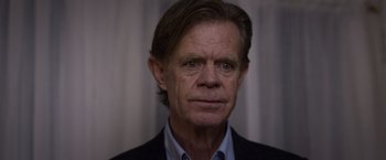 Movie still from “Room” (2015), directed by Lenny Abrahamson – An older man wearing a jacket and a shirt; Close Up shot, Over the shoulder angle