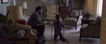 Movie still from “Room” (2015), directed by Lenny Abrahamson – A man and a little girl are playing a game together; Medium shot, High angle