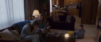 Movie still from “Room” (2015), directed by Lenny Abrahamson – Two women sitting on a couch in a living room; Wide shot, Over the shoulder angle