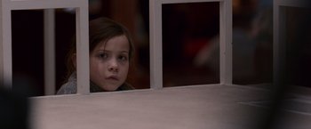 Movie still from “Room” (2015), directed by Lenny Abrahamson – A little girl sitting in front of a mirror looking sad; Close Up shot, High angle