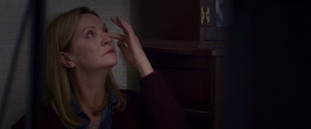 Movie still from “Room” (2015), directed by Lenny Abrahamson – A woman looking at her reflection in a mirror; Close Up shot, High angle