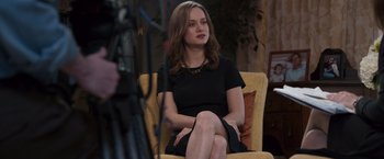 Movie still from “Room” (2015), directed by Lenny Abrahamson – A beautiful young lady sitting in a chair; Medium shot, Over the shoulder angle