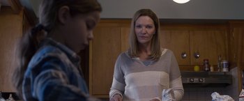 Movie still from “Room” (2015), directed by Lenny Abrahamson – A woman standing next to a young girl in a room; Medium shot, Over the shoulder angle