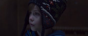 Movie still from “Room” (2015), directed by Lenny Abrahamson – A young boy wearing a knitted hat looking to his left; Close Up shot, Over the shoulder angle