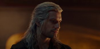 Movie still from “The Witcher” (2019), created by Lauren Schmidt Hissrich – A person with long white hair; Close Up shot, Over the shoulder angle