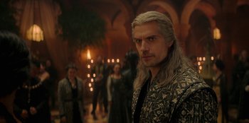 Movie still from “The Witcher” (2019), created by Lauren Schmidt Hissrich – A person with long white hair; Medium shot, Over the shoulder angle