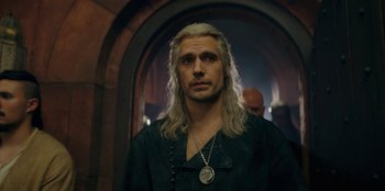 Movie still from “The Witcher” (2019), created by Lauren Schmidt Hissrich – A person with long white hair; Close Up shot, Over the shoulder angle