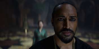 Movie still from “The Witcher” (2019), created by Lauren Schmidt Hissrich – A person with a beard; Close Up shot, Over the shoulder angle