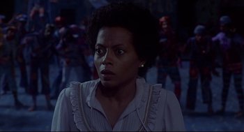 Movie still from “The Wiz” (1978), directed by Sidney Lumet – A woman in a white shirt is looking at the camera; Close Up shot, Low angle