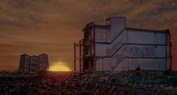 Movie still from “The Wiz” (1978), directed by Sidney Lumet – An abandoned building in the middle of the sunset; Extreme Wide shot, Low angle