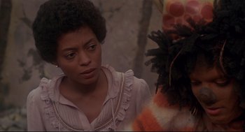 Movie still from “The Wiz” (1978), directed by Sidney Lumet – A woman standing next to another woman in a room; Close Up shot, Over the shoulder angle