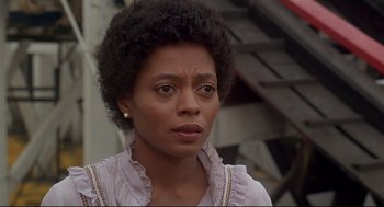 Movie still from “The Wiz” (1978), directed by Sidney Lumet – A person wearing a dress; Close Up shot, Over the shoulder angle