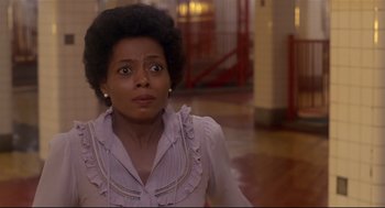 Movie still from “The Wiz” (1978), directed by Sidney Lumet – A woman with a surprised look on her face in a hallway; Close Up shot, Low angle