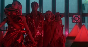 Movie still from “The Wiz” (1978), directed by Sidney Lumet – A group of people dressed up in red; Medium shot, Low angle