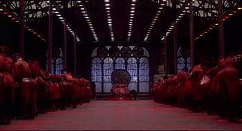 Movie still from “The Wiz” (1978), directed by Sidney Lumet – A group of people standing in front of a large window; Extreme Wide shot, High angle