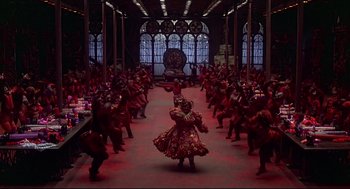 Movie still from “The Wiz” (1978), directed by Sidney Lumet – A large group of people are dancing in a room; Extreme Wide shot, High angle