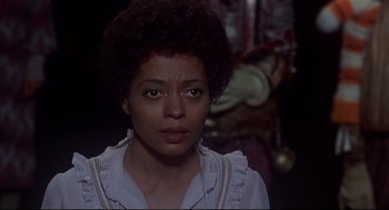 Movie still from “The Wiz” (1978), directed by Sidney Lumet – A person wearing a white shirt; Close Up shot, Over the shoulder angle