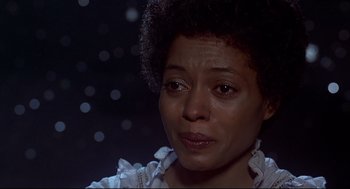 Movie still from “The Wiz” (1978), directed by Sidney Lumet – An older woman with short black hair looking at the camera; Close Up shot, Low angle