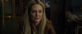 Movie still from “The Woman in the Window” (2021), directed by Joe Wright – A person with long hair; Close Up shot, Over the shoulder angle