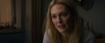 Movie still from “The Woman in the Window” (2021), directed by Joe Wright – A person with long hair; Close Up shot, Over the shoulder angle