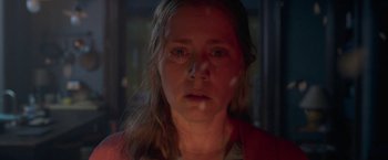 Movie still from “The Woman in the Window” (2021), directed by Joe Wright – A person looking at the camera; Close Up shot, Over the shoulder angle