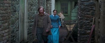 Movie still from “The Wonder” (2022), directed by Sebastián Lelio – Wide shot, Over the shoulder angle