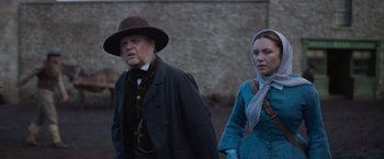 Movie still from “The Wonder” (2022), directed by Sebastián Lelio – Medium shot, Over the shoulder angle