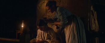 Movie still from “The Wonder” (2022), directed by Sebastián Lelio – Medium shot, High angle