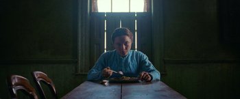 Movie still from “The Wonder” (2022), directed by Sebastián Lelio – Medium shot, Low angle