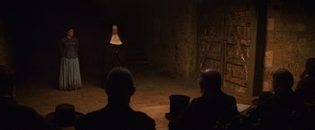 Movie still from “The Wonder” (2022), directed by Sebastián Lelio – Wide shot, Over the shoulder angle