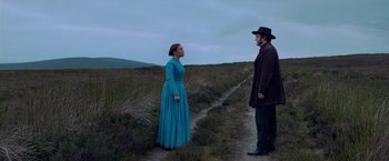 Movie still from “The Wonder” (2022), directed by Sebastián Lelio – Wide shot, Over the shoulder angle