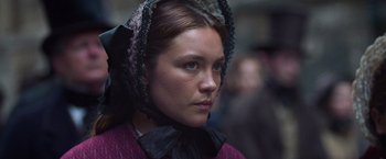 Movie still from “The Wonder” (2022), directed by Sebastián Lelio – A person wearing a headdress; Close Up shot, Over the shoulder angle