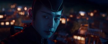 Movie still from “The Yin-Yang Master: Dream of Eternity” (2020), directed by Jingming Guo – A person wearing a hat; Close Up shot, Over the shoulder angle