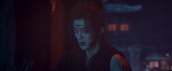 Movie still from “The Yin-Yang Master: Dream of Eternity” (2020), directed by Jingming Guo – A person with a black and white makeup on their face; Close Up shot, Over the shoulder angle