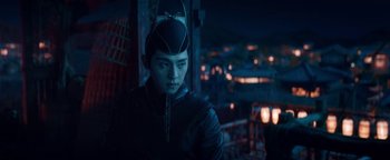 Movie still from “The Yin-Yang Master: Dream of Eternity” (2020), directed by Jingming Guo – A person wearing a black outfit and a black hat; Medium shot, Over the shoulder angle