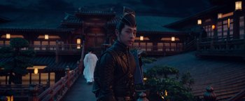 Movie still from “The Yin-Yang Master: Dream of Eternity” (2020), directed by Jingming Guo – A man in a samurai outfit holding a sword; Medium shot, Over the shoulder angle
