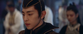 Movie still from “The Yin-Yang Master: Dream of Eternity” (2020), directed by Jingming Guo – A person wearing a hat; Close Up shot, Over the shoulder angle