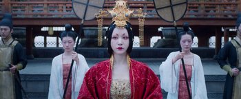 Movie still from “The Yin-Yang Master: Dream of Eternity” (2020), directed by Jingming Guo – A woman in a red and gold costume holding an umbrella; Close Up shot, Low angle