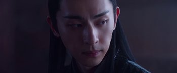 Movie still from “The Yin-Yang Master: Dream of Eternity” (2020), directed by Jingming Guo – A person with long black hair; Close Up shot, Over the shoulder angle