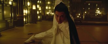 Movie still from “The Yin-Yang Master: Dream of Eternity” (2020), directed by Jingming Guo – A man in a white shirt and a long black hair; Medium shot, Low angle