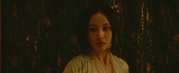 Movie still from “The Yin-Yang Master: Dream of Eternity” (2020), directed by Jingming Guo – A woman in a white robe is looking at the camera; Close Up shot, Over the shoulder angle