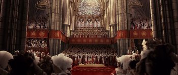 Movie still from “The Young Victoria” (2009), directed by Jean-Marc Vallée – A large group of people standing in front of a cathedral; Extreme Wide shot, High angle