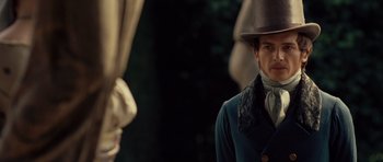 Movie still from “The Young Victoria” (2009), directed by Jean-Marc Vallée – A man wearing a top hat and a blue coat; Close Up shot, Over the shoulder angle